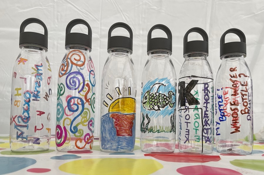 6 hand painted bottles painted on a glass painting workshop.