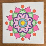 Pink, green, Purple, Yellow and blue flower type mandala drawing, drawn in corporate art class.